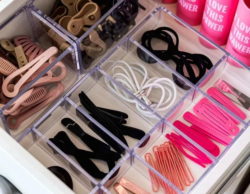 Hair accessory drawer organization: clear dividers make it easy